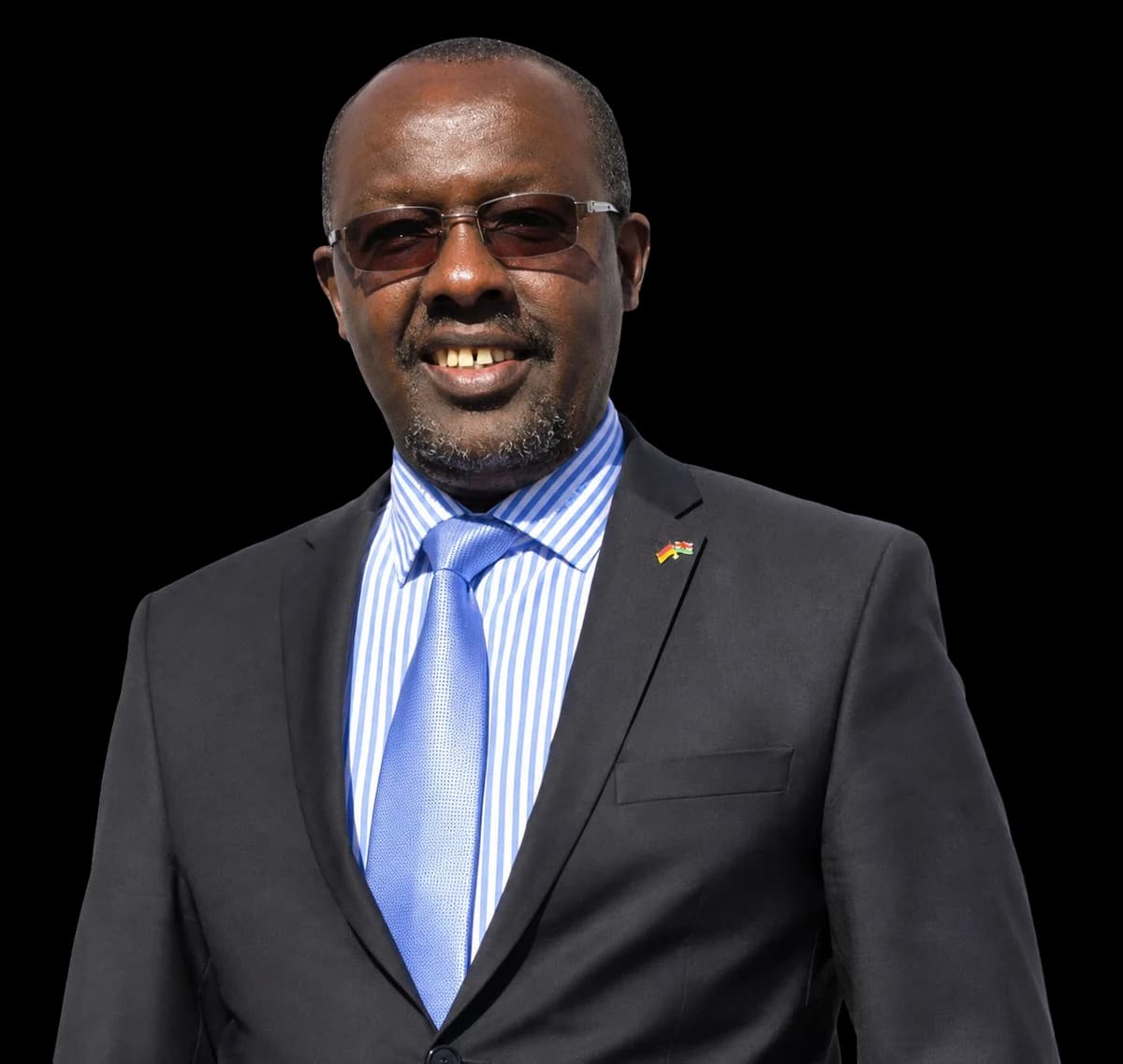 Portrait of Dr. Seronei Chelulei Cheison, founder of Sinonin Biotech, in a dark suit and blue tie.